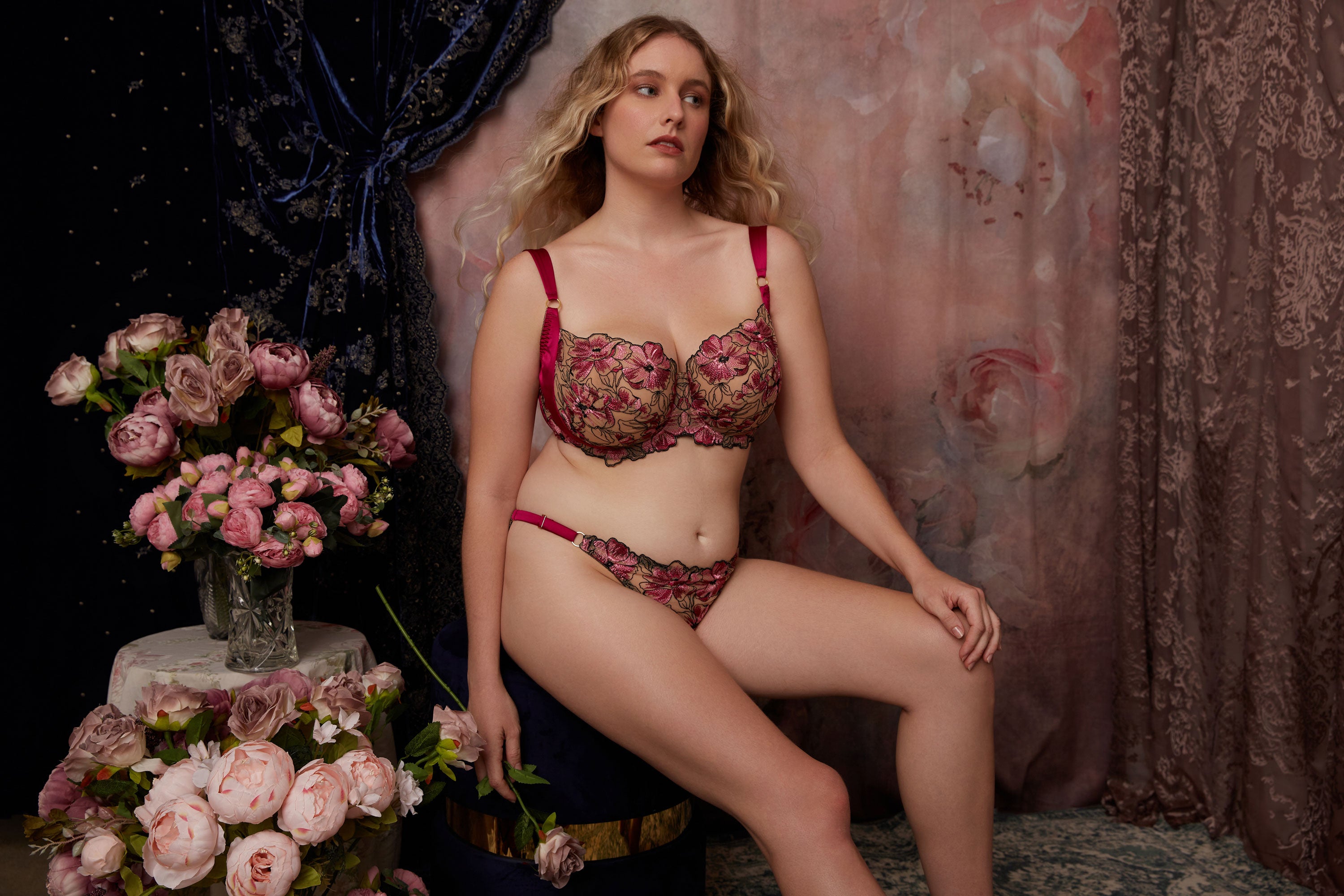 Luxury pink and black floral lingerie seton background of pink roses and blue velvet 